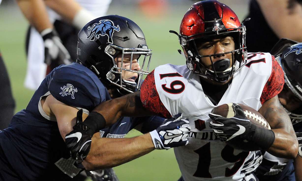 San Diego State running back Donnel Pumphrey (19) carries the ball against Utah State defensive back Dallin Leavitt (2) during an NCAA college football game Friday, Oct. 28, 2016, in Logan, Utah. (Photo: Eli Lucero, Logan Herald Journal via AP)