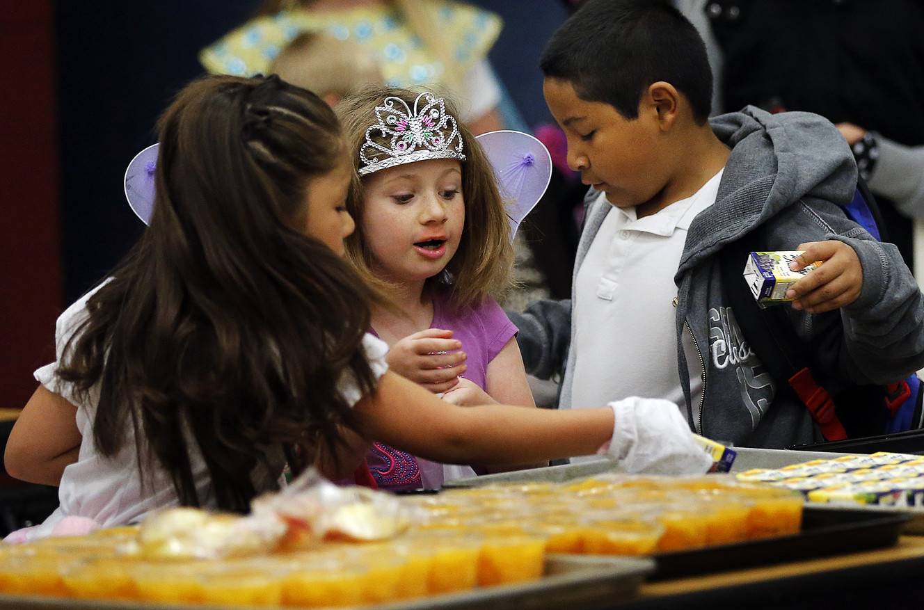 Andrea, left, Hailey and Diego choose their food during the Breakfast in the Classroom program at Backman Elementary School in Salt Lake City on Friday, Oct. 28, 2016. (Photo: Ravell Call, Deseret News)