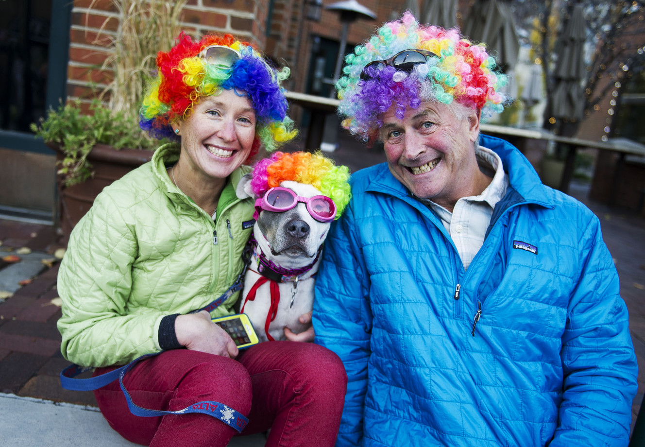 Jessica, left, Betsy and Coleman Motley rock clown wigs in Park City on Monday, Oct. 31, 2016. Hundreds of people decked out in costumes paraded among each other and their dogs during the city's annual Halloween on Main Street event. (Photo: Nick Wagner, Deseret News)