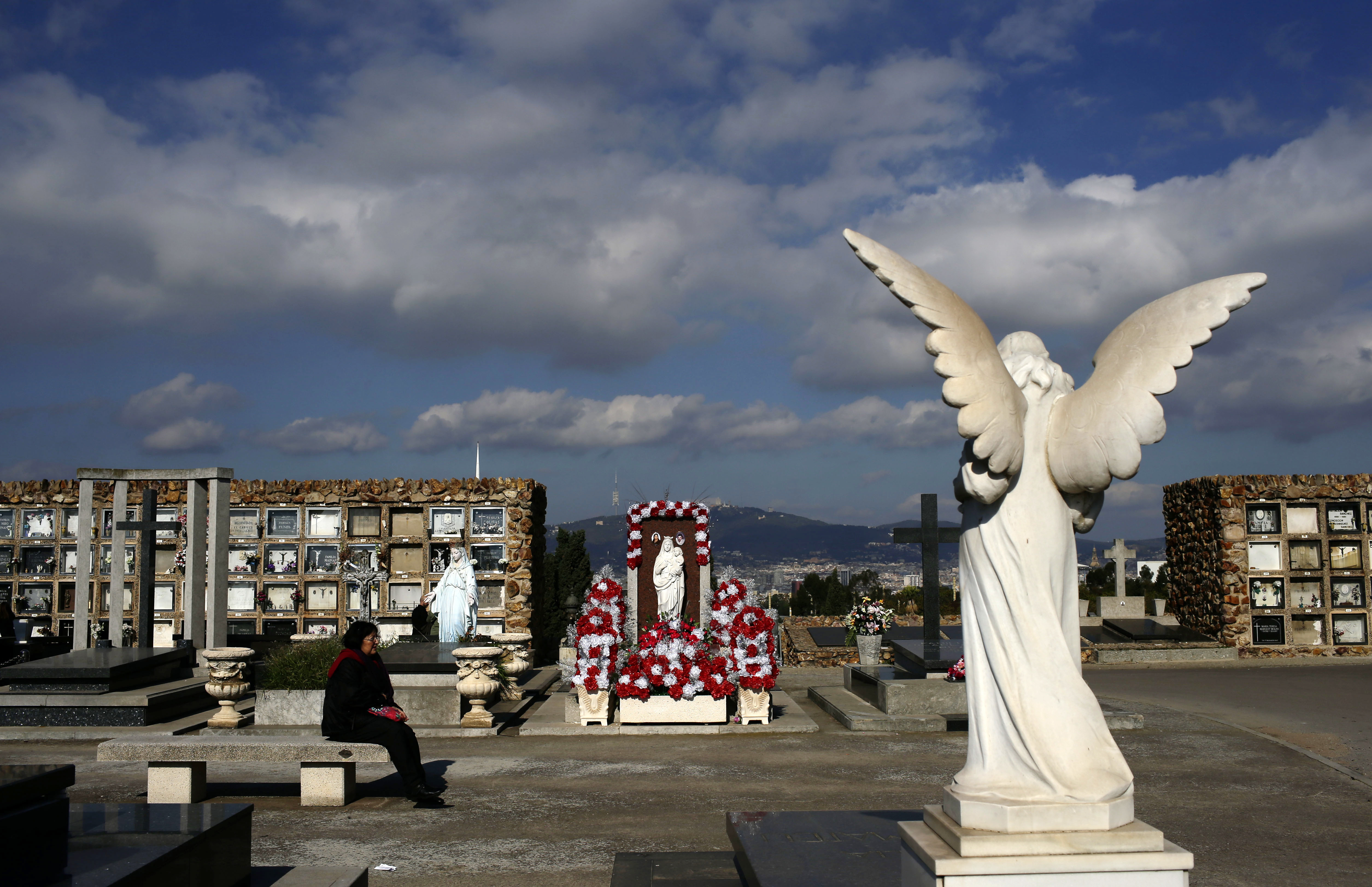 AP Photos: Poles honor heroes, loved ones on All Saints' Day