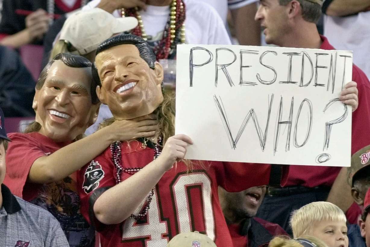 FILE - IN this Nov. 12, 2000 file photo, fans, one dressed as Republican presidential candidate Texas Gov. George W. Bush, left, playfully chokes a fan dressed as Democratic presidential candidate Vice President Al Gore. Photo: AP Photo