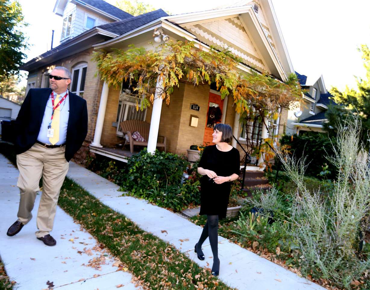 Cory Lyman, Emergency Management Program director for Salt Lake City, speaks with Catherine Lilly at her home in Salt Lake City on Thursday, Nov. 3, 2016. Lilly used the city's Fix the Bricks program to stabilize the chimney on her 1904 house. The program provides financial assistance for retrofitting homes that are most vulnerable in a major earthquake. (Photo: Laura Seitz, Deseret News)