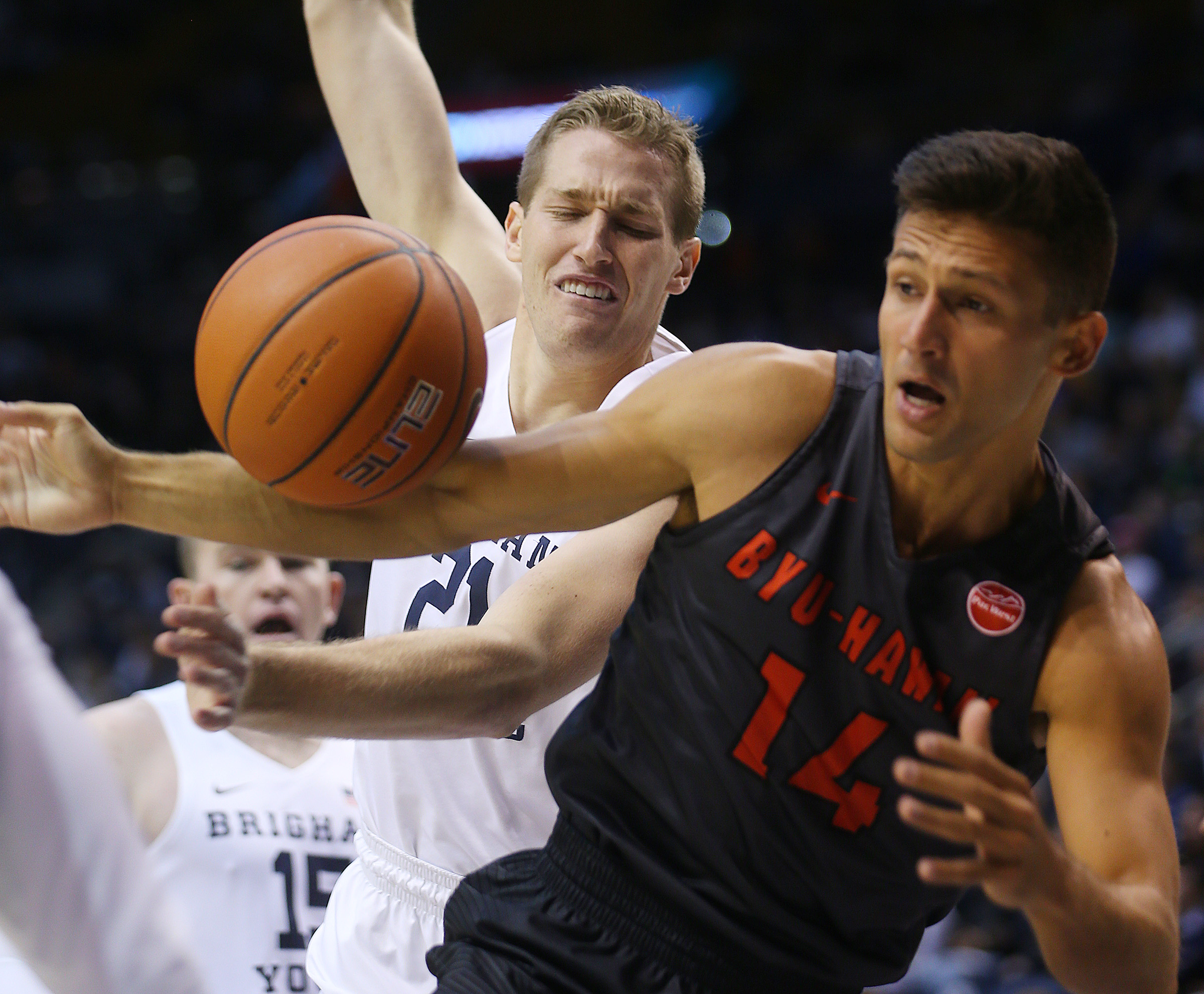BYU forward Kyle Davis (21) loses the ball with BYU-Hawaii guard Gabriel Andrade (14) defending him as BYU and BYU-Hawaii play in preseason action at the Marriott Center in Provo on Wednesday, Nov. 9, 2016. (Photo: Scott G Winterton, Deseret News)