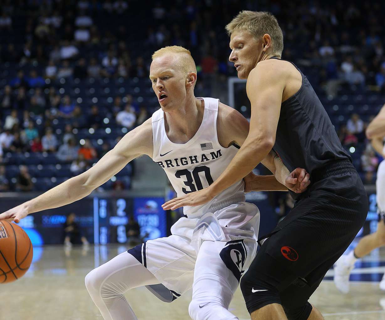 BYU guard TJ Haws (30) is guarded by BYU-Hawaii guard Tanner Nelson (3) as BYU and BYU-Hawaii play in preseason action at the Marriott Center in Provo on Wednesday, Nov. 9, 2016. (Photo: Scott G Winterton, Deseret News)