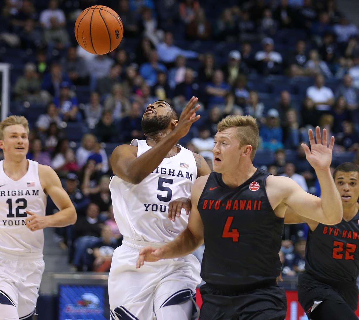 BYU guard L.J. Rose (5) loses the ball as BYU-Hawaii guard Shad Watson (4) defends him as BYU and BYU-Hawaii play in preseason action at the Marriott Center in Provo on Wednesday, Nov. 9, 2016. (Photo: Scott G Winterton, Deseret News)