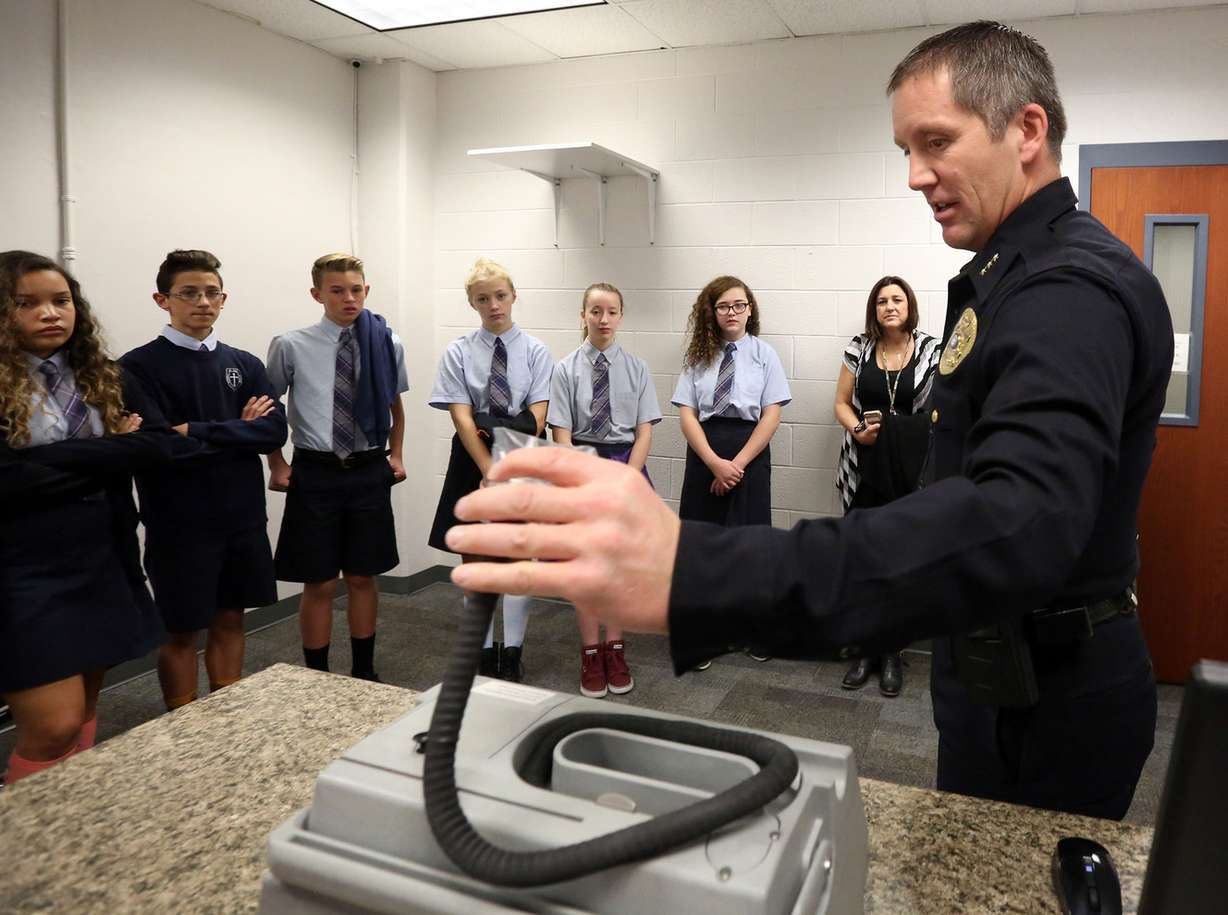 Bountiful Assistant Police Chief Ed Biehler shows eighth-graders from St. Olaf Catholic School a breathalyzer while giving the students a tour of the police station in Bountiful on Wednesday, Nov. 16, 2016. (Photo: Kristin Murphy, Deseret News)
