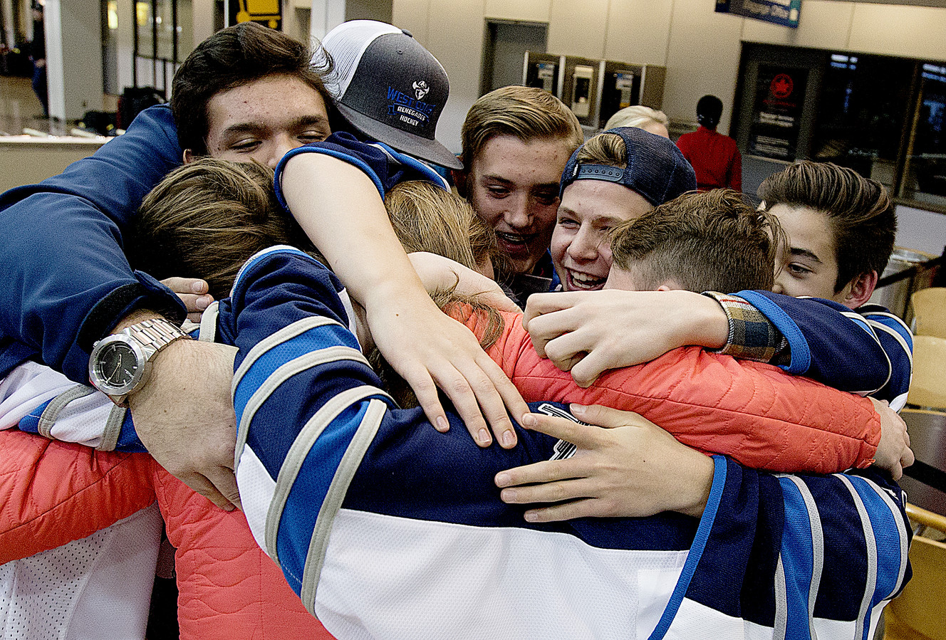 Karsen Wight is welcomed home by his West Coast Renegade hockey teammates at the Salt Lake City International Airport on Friday, Nov. 18, 2016. Photo: Laura Seitz, Deseret News