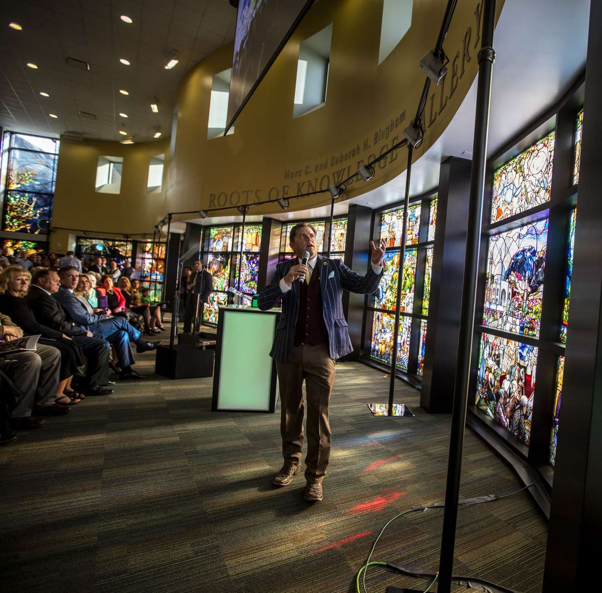 Artist Tom Holdman speaks after the unveiling of the “Roots of Knowledge” in the Fulton Library on the Utah Valley University campus in Orem on Nov. 18, 2016.