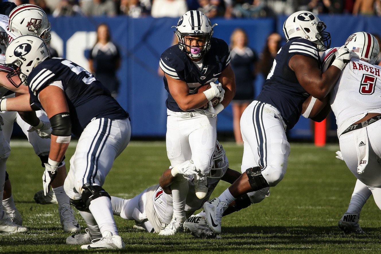 BYU's KJ Hall (20) runs the ball during a game against the UMass Minutemen at LaVell Edwards Stadium in Provo on Saturday, Nov. 19, 2016. (Photo: Spenser Heaps, Deseret News)