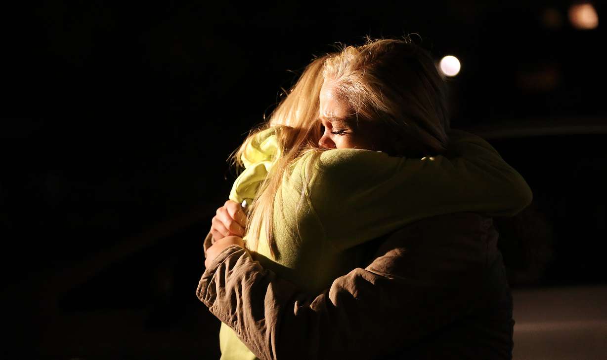 Nicole Scott and Berkley Dunford hug as friends and family hold a vigil for Corner Canyon High School students Lexie Fenton and Ethan Fraga at Draper Park in Draper on Sunday, Nov. 20, 2016. Both were killed in an auto accident on Highland Drive in Draper. (Jeffrey D. Allred, Deseret News)