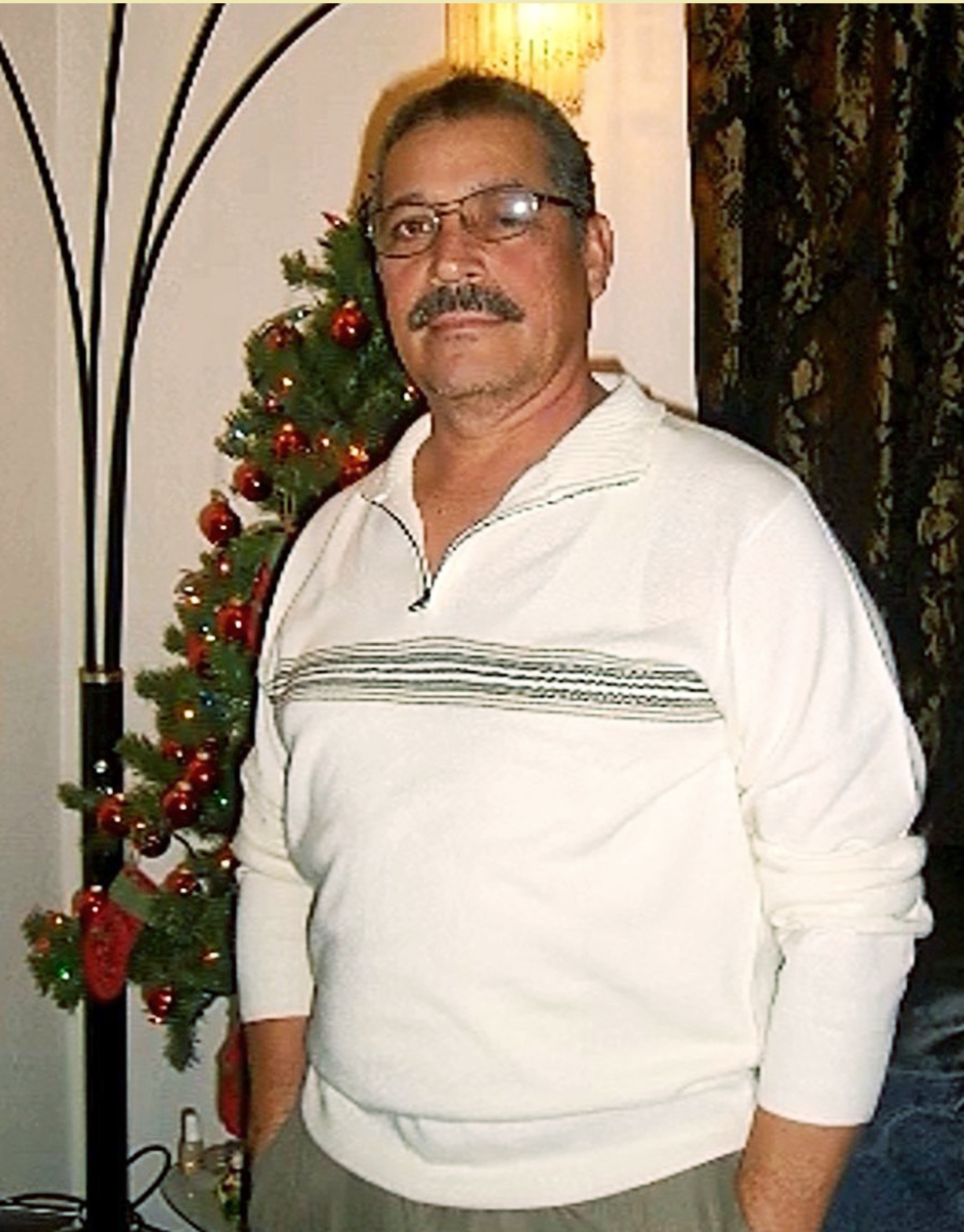 This undated photo provided by Zoila Barrera shows Julio Villamariona at a family gathering in the Reseda area of Los Angeles. Villamariona was run over and killed by a van while guarding a set for the television series "NCIS" in February, 2011, leaving behind a wife and three daughters who he moved to the United States from El Salvador to escape violence there. Making movies and television shows can be a dangerous business. An investigation by The Associated Press has found that at least 43 set workers have died in the United States since 1990, with hundreds injured worldwide. (Zoila Barrera via AP)
