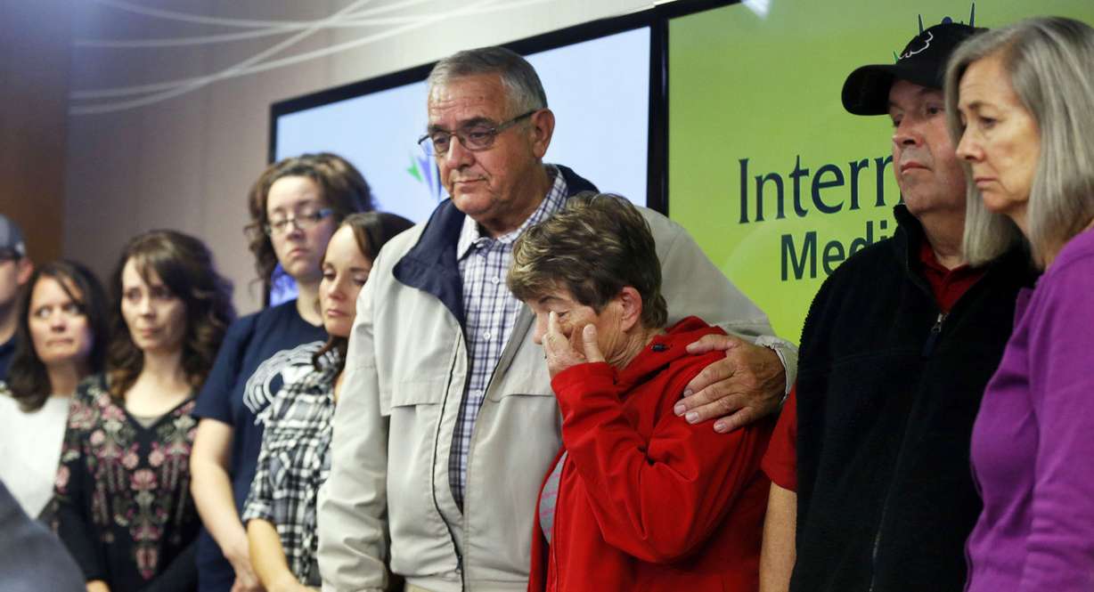 Ron and Margie Ellsworth, center, parents of Utah Highway Patrol trooper Eric Ellsworth, listen as family member Jason Moyes reads a statement to the media in Murray on Tuesday, Nov. 22, 2016. Trooper Ellsworth was critically injured when he was struck by a vehicle while directing traffic on Friday, Nov. 18, 2016. (Photo: Ravell Call, Deseret News)