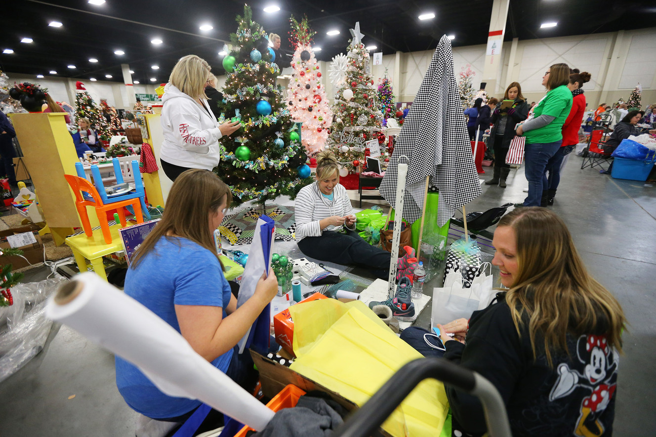 Members of the Allen Family decorate a tree in honor of Avery Allen, a member of their family who almost drowned, in preparation for the Festival of Trees at the South Towne Center in Sandy on Monday, Nov. 28, 2016. The festival runs Wednesday, Nov. 30 through Saturday, Dec. 3, from 10 a.m. to 10 p.m. each day. (Photo: Scott G Winterton, Deseret News)
