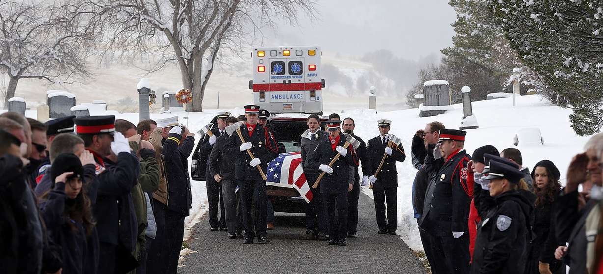 Family, friends and an honor guard accompany Jake Shepherd's casket during graveside services in Mendon on Monday, Nov. 28, 2016. Shepherd was one of three crew members of a medical aircraft that crashed just after takeoff on Nov. 18 while transporting a patient from Elko, Nevada, to University Hospital in Salt Lake City. All four people died in the crash. (Photo: Ravell Call, Deseret News)