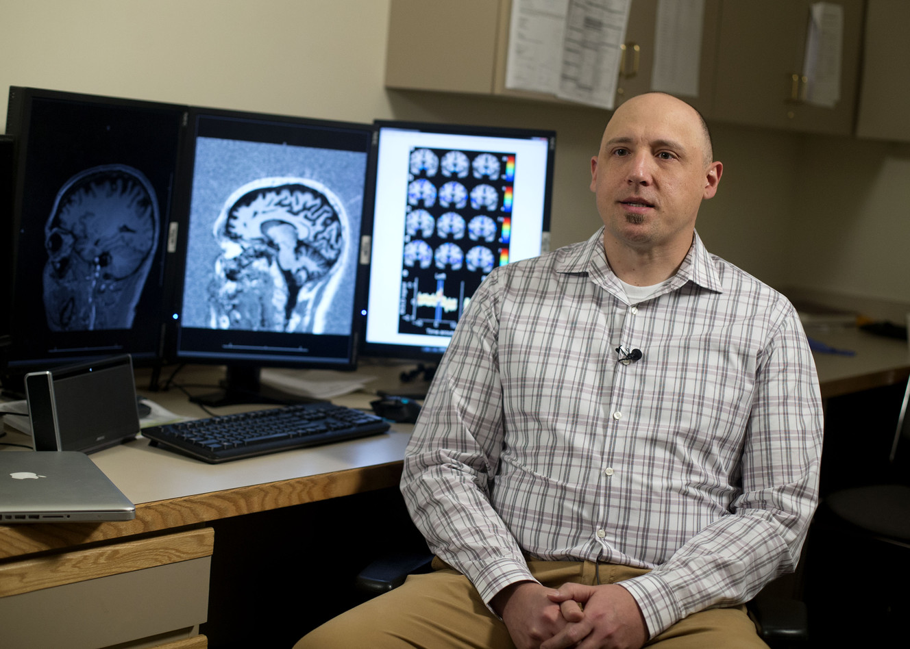 Jace King discusses the data he collected at the Imaging & Neurosciences Center in Salt Lake City on Wednesday, Nov. 23, 2016. Photo: Laura Seitz, Deseret News