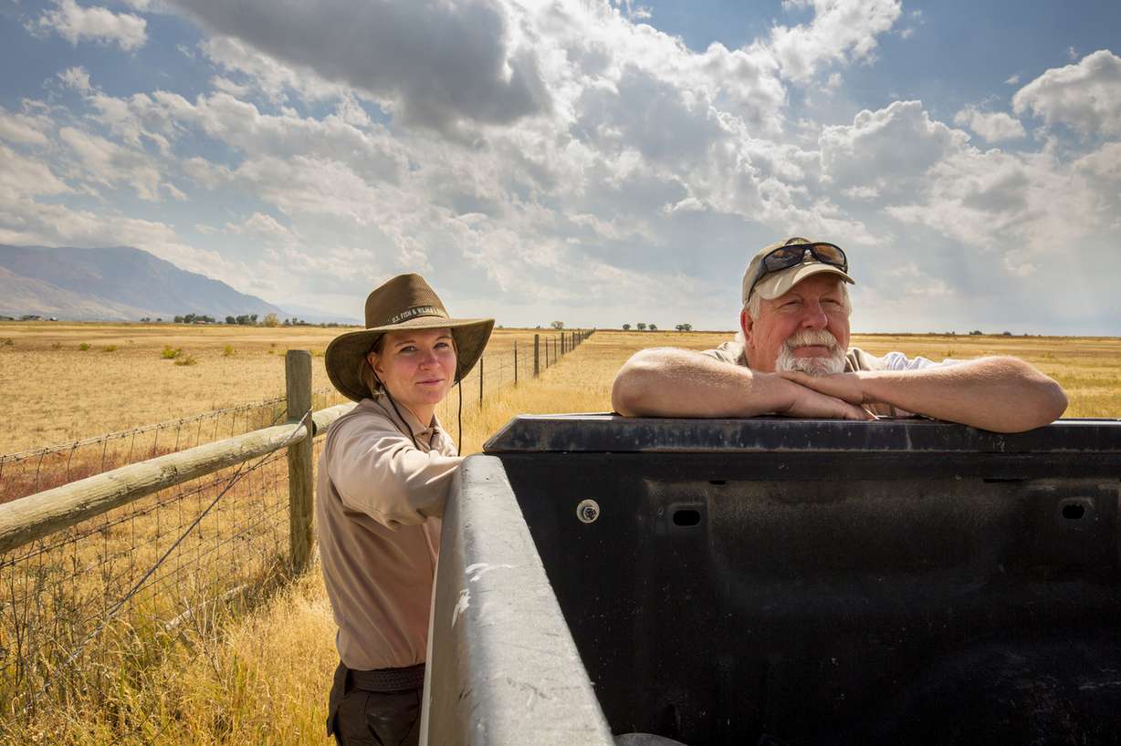 Katie McVey, wildlife refuge specialist, and Brian Ferguson, a
U.S. Fish and Wildlife Service volunteer, are pictured at the Bear River Migratory Bird Refuge. The refuge is featured in a new documentary that explores the benefits of a wildlife refuge next to an urban center. (Photo: Ian Shive, Tandem, U.S. Fish & Wildlife Service)