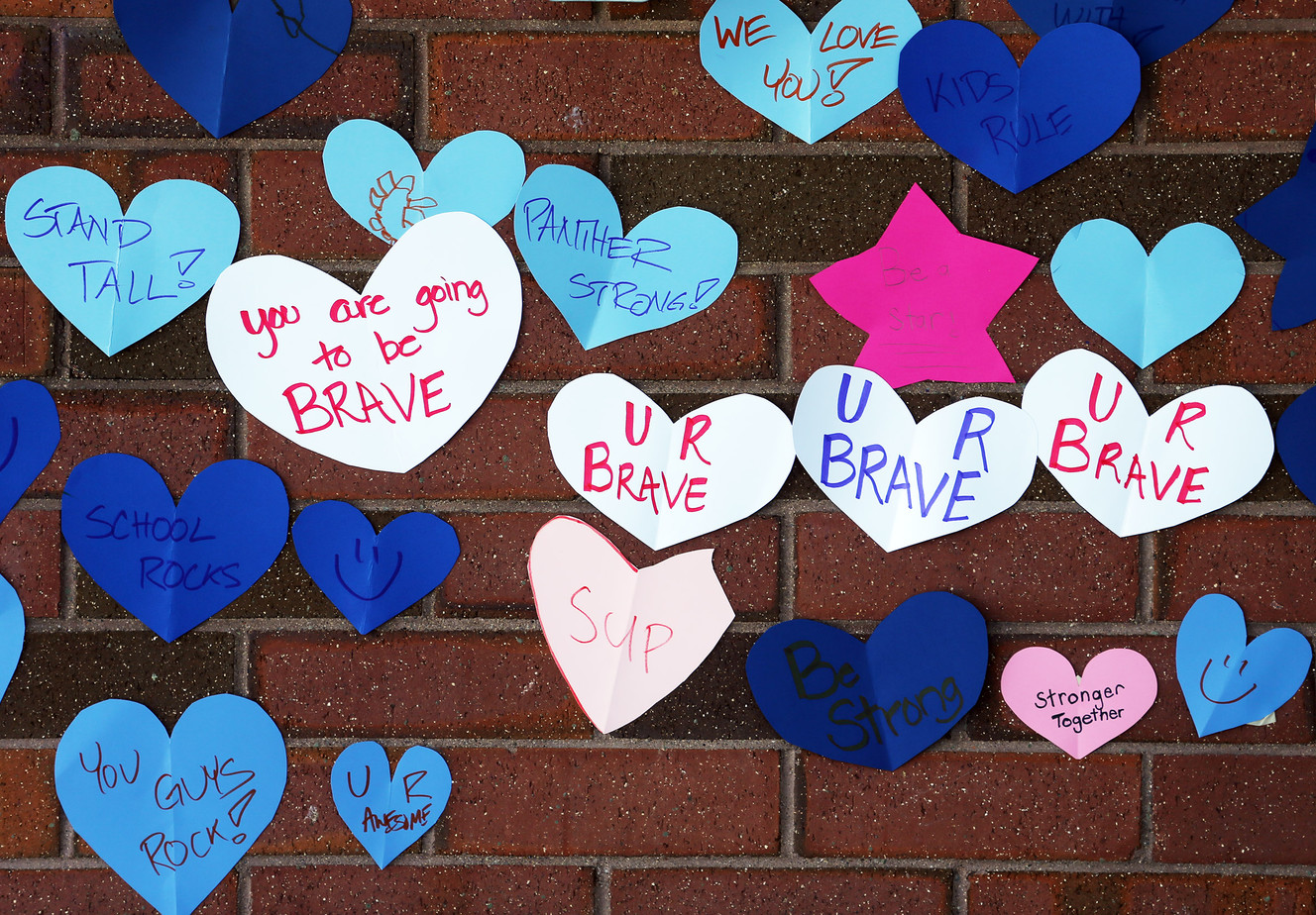 Hundreds of paper hearts and signs from the community line the walls of Mueller Park Junior High School in Bountiful on Friday, Dec. 2, 2016, a day after a student fired a gun inside the school. (Photo: Scott G Winterton, Deseret News)