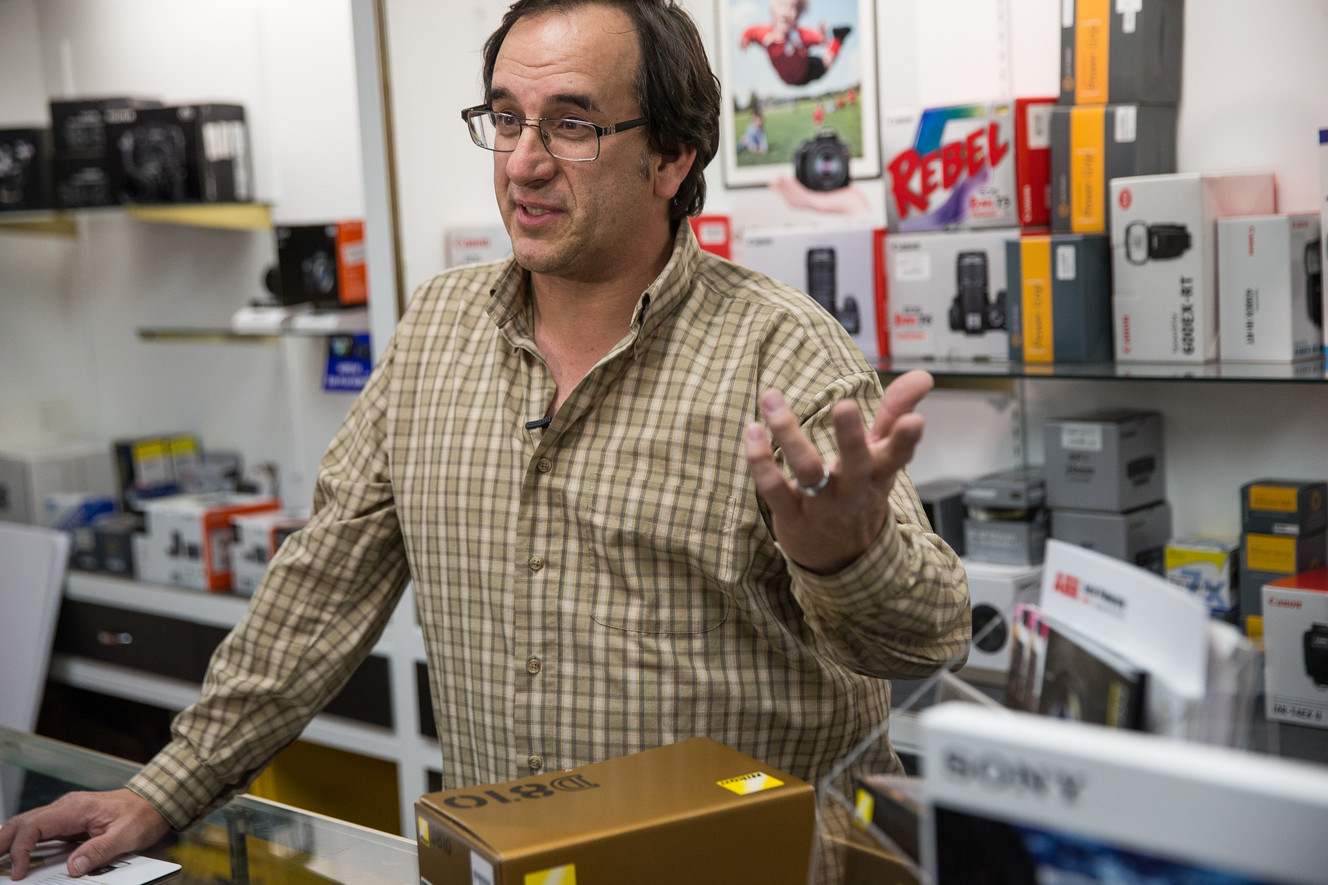 Ethan Allen, co-owner of Allen's Camera, talks about his reaction to the news that Amazon.com will have to start collecting sales tax in Utah at his Holladay store location on Thursday, Dec. 8, 2016. He said it will help level the playing field between the internet sales behemoth and his four camera stores. (Photo: Spenser Heaps, Deseret News)