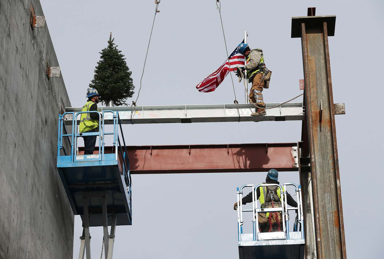 Layton Construction crews perform a topping-out ceremony with a signed 16-foot beam on the new Hale Centre Theatre in Sandy on Friday, Dec. 9, 2016. Photo: Jeffrey D. Allred, Deseret News