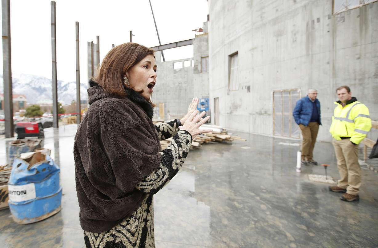 Sally Dietlein, Hale Centre Theatre co-founder, takes dignitaries on a tour of the new facility in Sandy on Friday, Dec. 9, 2016, during a topping-out ceremony. Photo: Jeffrey D. Allred, Deseret News