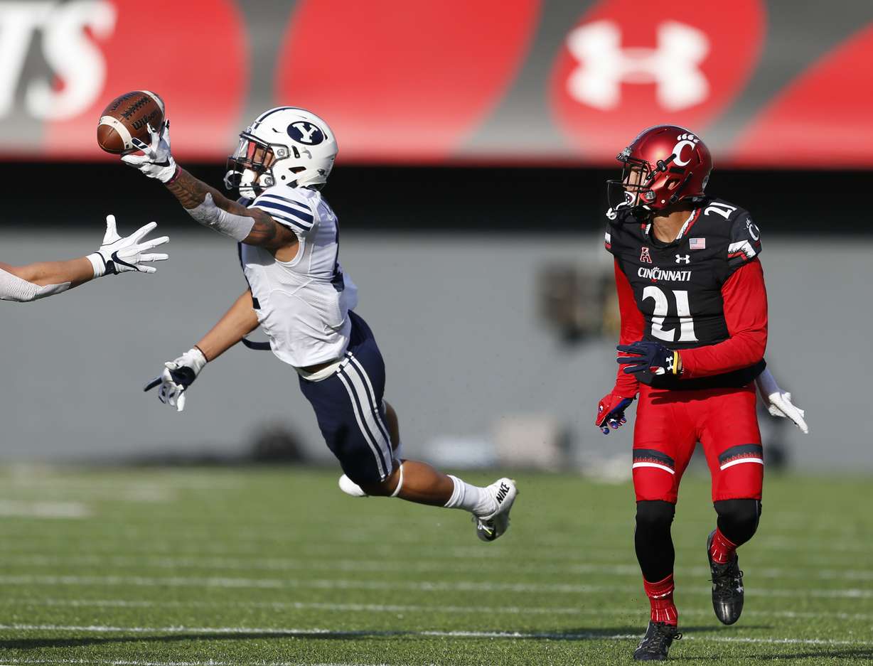 BYU defensive back Troy Warner, left, breaks up a pass intended for Cincinnati wide receiver Devin Gray (21) during the first half of an NCAA college football game, Saturday, Nov. 5, 2016, in Cincinnati. (AP Photo, Gary Landers)