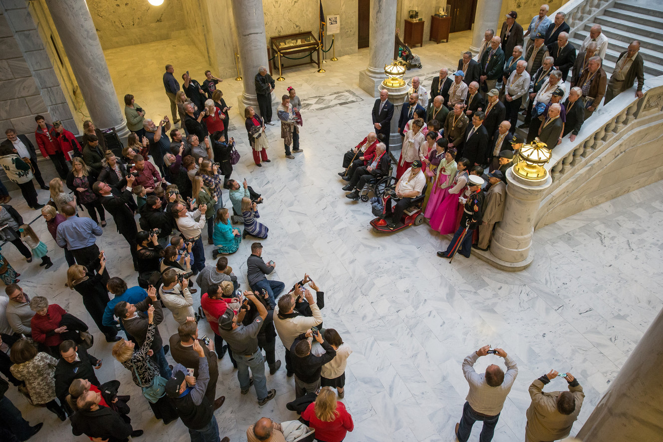 Korean War veterans gather on a staircase for a group photo at the Utah State Capitol in Salt Lake City on Saturday, Dec. 10, 2016. (Photo: Spenser Heaps, Deseret News)