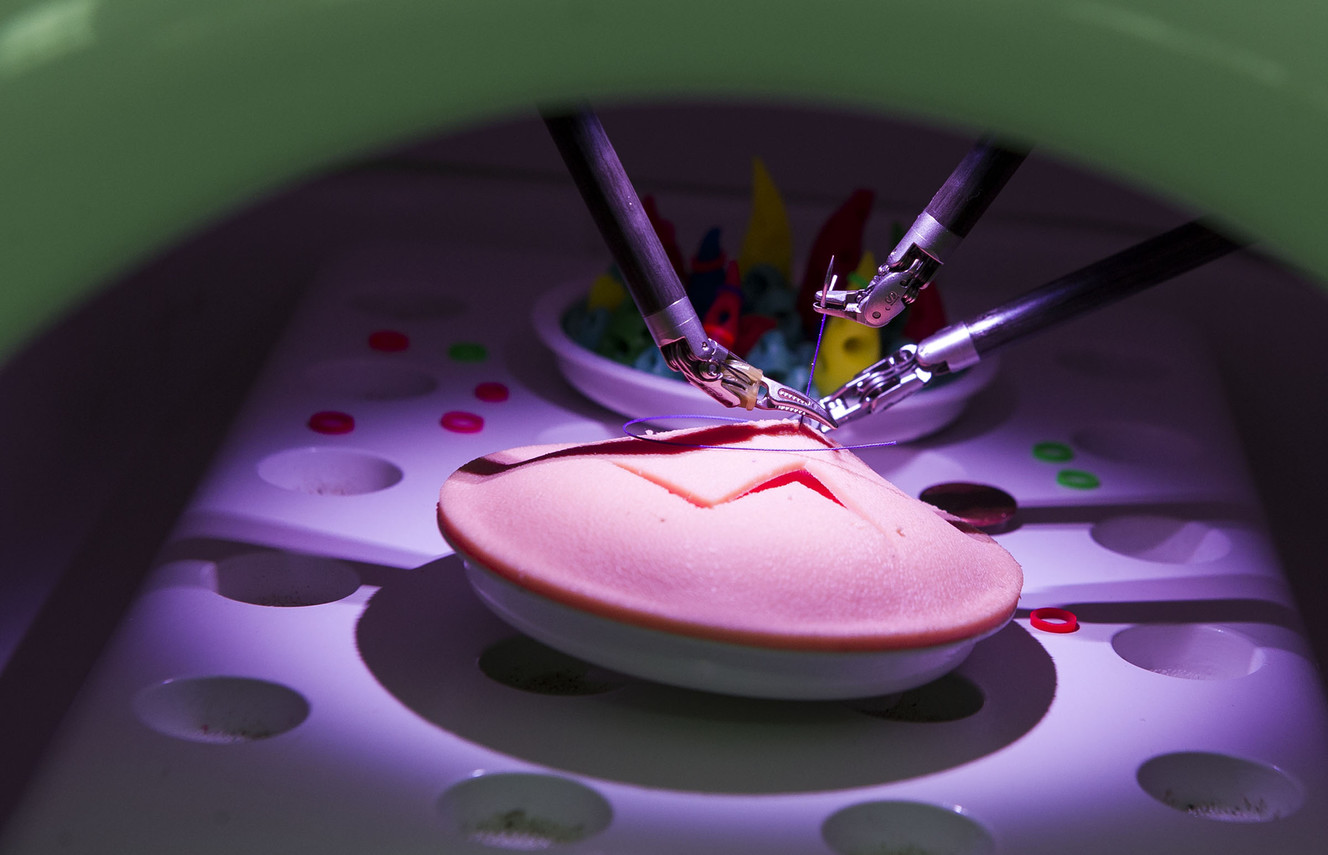 A da Vinci Xi surgery robot sutures a practice incision at St. Mark's Hospital in Salt Lake City on Friday, Dec. 16, 2016. The robot mimics a surgeon’s hand movements but with a wider range of motion using robotic arms, allowing physicians to perform complex dissections or reconstructions with a much smaller incision. As a result, patients experience less trauma, reduced pain, faster recovery times and minimal scarring. (Photo: Nick Wagner, Deseret News)