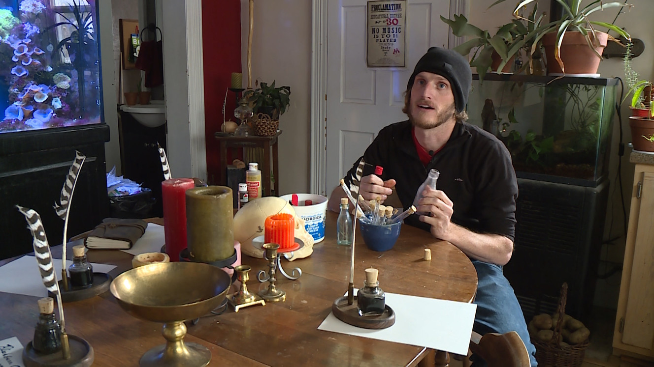 Benjamin Lee-Roche shows one of his antique bottles, which he turns into 'potion bottles.' (Photo: Ray Boone)