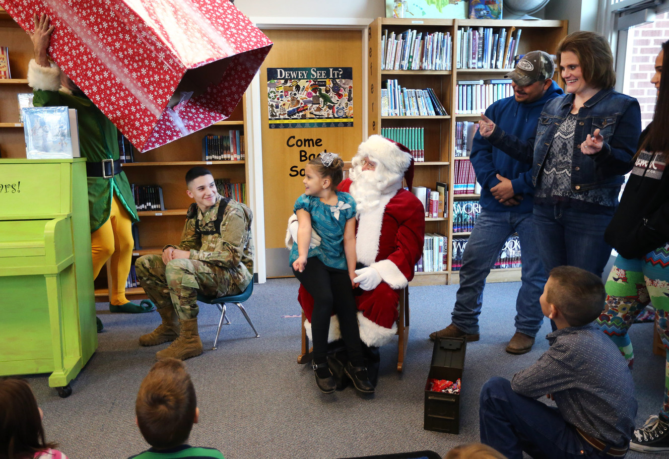 Pvt. Dylan Ramirez surprises his little sister Brisa and his other family members at Geneva Elementary School in Orem on Monday, Dec. 19, 2016. (Photo: Scott G Winterton, Deseret News)