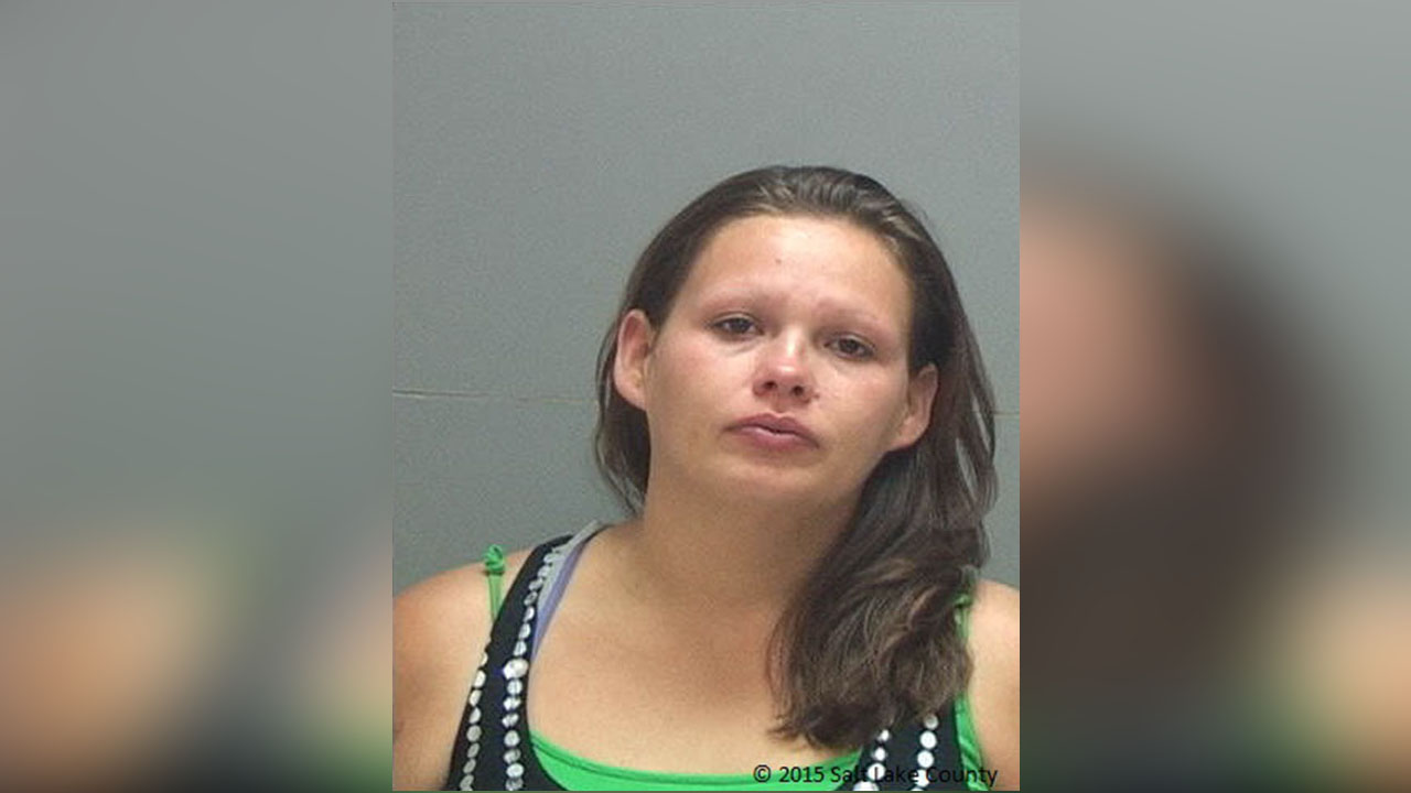 Woman, 1 of 4 charged with murder in robbery, admits to reduced charge