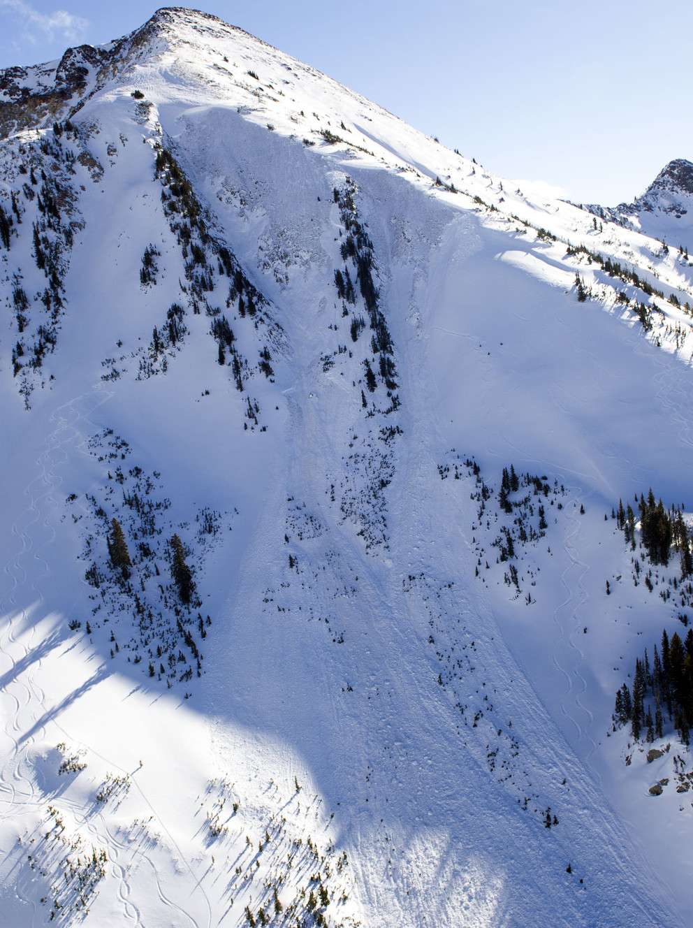 An avalanche's path is seen in Little Cottonwood Canyon on Tuesday, Dec. 20, 2016. The avalanche occurred when two backcountry skiers descended the mountainside, prompting a response from Unified Police, Backcountry Rescue, Alta marshals and the DPS helicopter. (Photo: Nick Wagner, Deseret News)