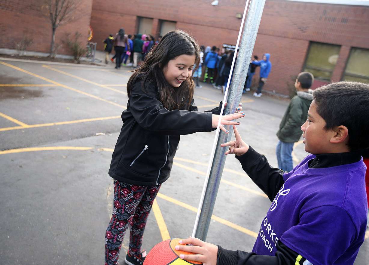 Third-grader Shayla Alfaro and Playworks junior coach Tevita Fonua use "Ro-sham-bo" to decide who goes first during a game of tetherball at Lincoln Elementary School in Salt Lake City on Thursday, Dec. 22, 2016. Photo: Laura Seitz, Deseret News