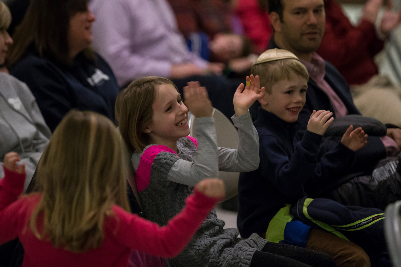 Rowan Firszt, 4, Kayla Sternfield, 7, and Benjamin Firszt, 8, clap and sing along during a celebration of Hanukkah at the state Capitol in Salt Lake City on Tuesday, Dec. 27, 2016. (Photo: Spenser Heaps, Deseret News)