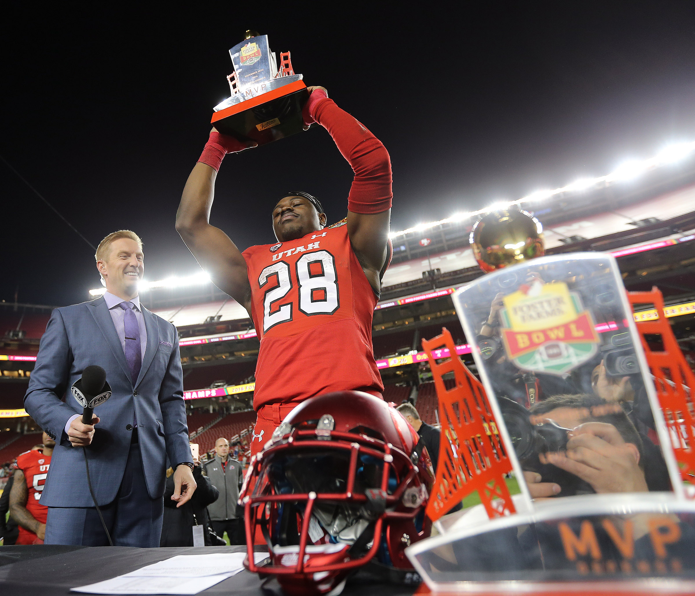 Utah Utes running back Joe Williams (28) holds up his offensive player of the game as the Utes defeat the Hoosiers in the Foster Farms Bowl in Santa Clara, California on Wednesday, Dec. 28, 2016. (Photo: Scott G. Winterton, Deseret News)