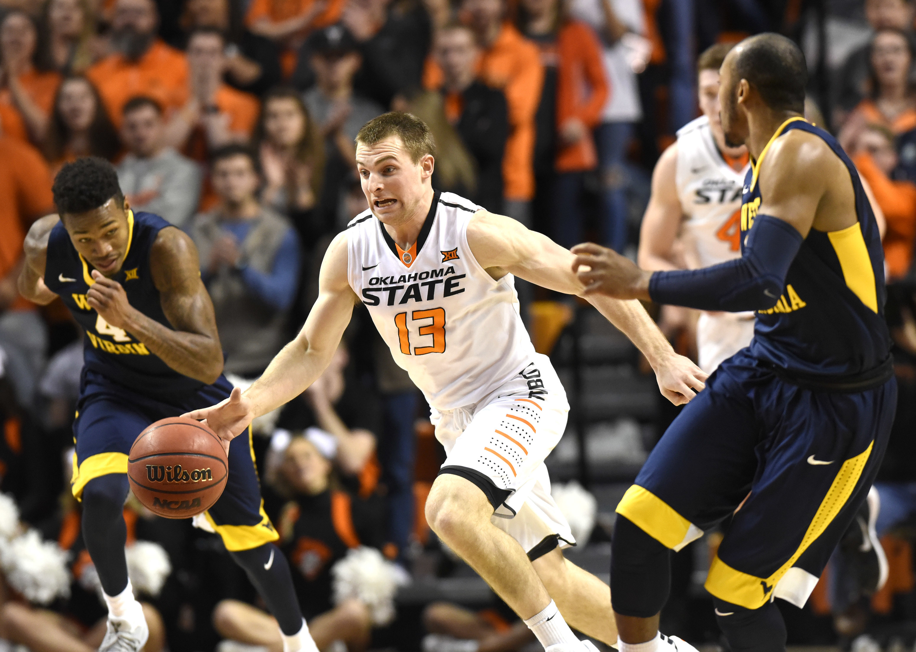 Miles, Carter lead No. 11 West Virginia over Oklahoma State