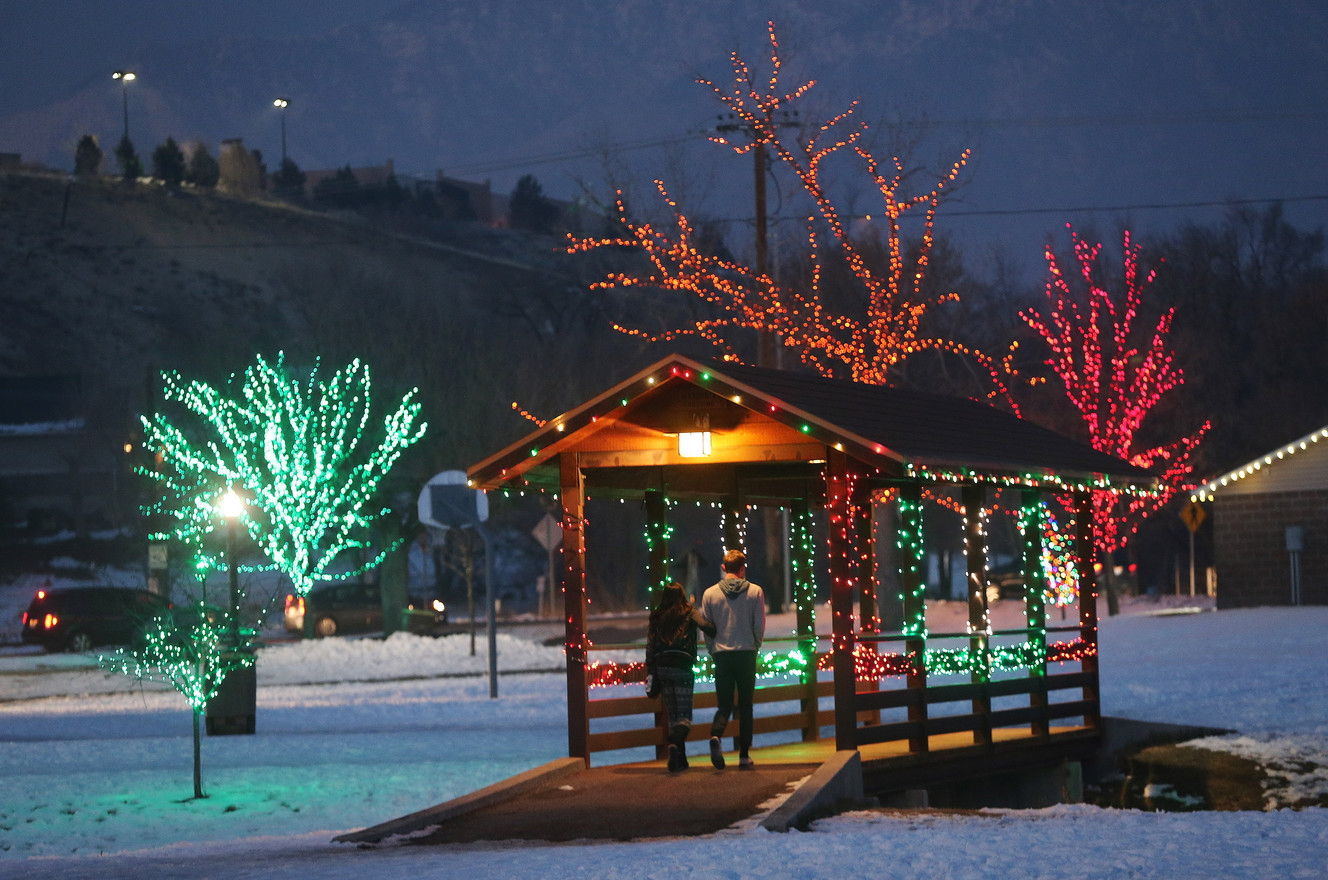 A couple look over the Tree of Life at Draper City Park in Draper on Friday, Dec. 30, 2016. A lone willow tree lights the air with over 1,000 strands of lights (Photo: Jeffrey D. Allred, Deseret News)
