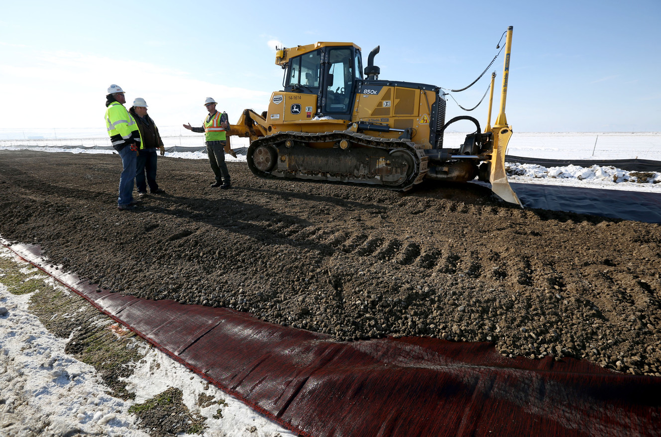 (Photo: Kristin Murphy, Deseret News) Mike Larsen, Jeff Harrison and Blaine Cozzens work on a temporary road to access the new prison site in Salt Lake City on Wednesday, Dec. 28, 2016.