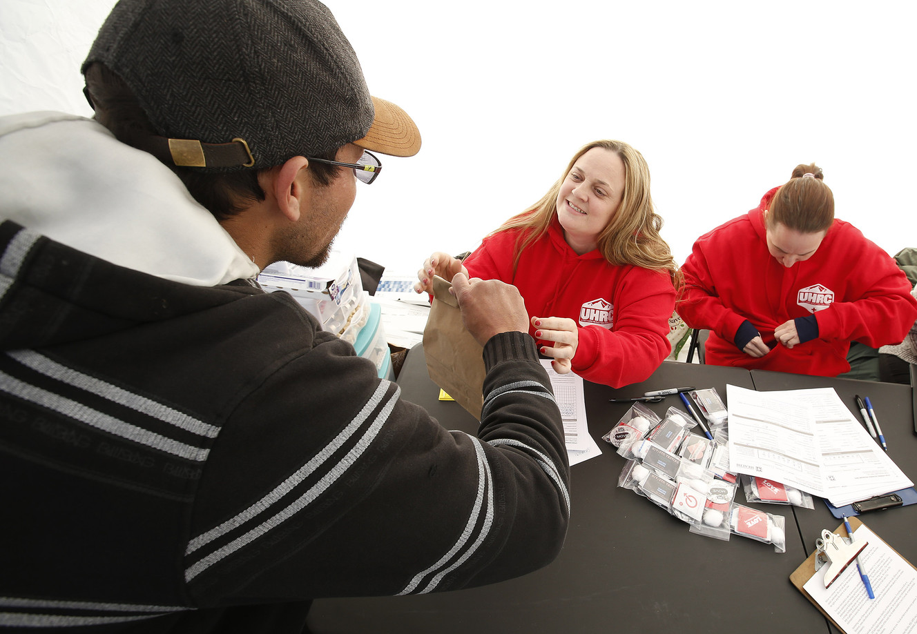 Social worker Mindy Vincent hands out syringes during an exchange program in Salt Lake City on Thursday, Dec. 29, 2016. Vincent is a former drug addict who is now clean. After she lost a sister to an overdose, she decided to start Utah's first syringe exchange program. (Photo: Jeffrey D. Allred, Deseret News)
