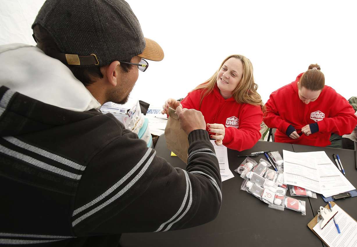 Social worker Mindy Vincent hands out syringes during an exchange program in Salt Lake City on Thursday, Dec. 29, 2016. Vincent is a former drug addict who is now clean. After she lost a sister to an overdose, she decided to start Utah's first syringe exchange program. (Photo: Jeffrey D. Allred, Deseret News)