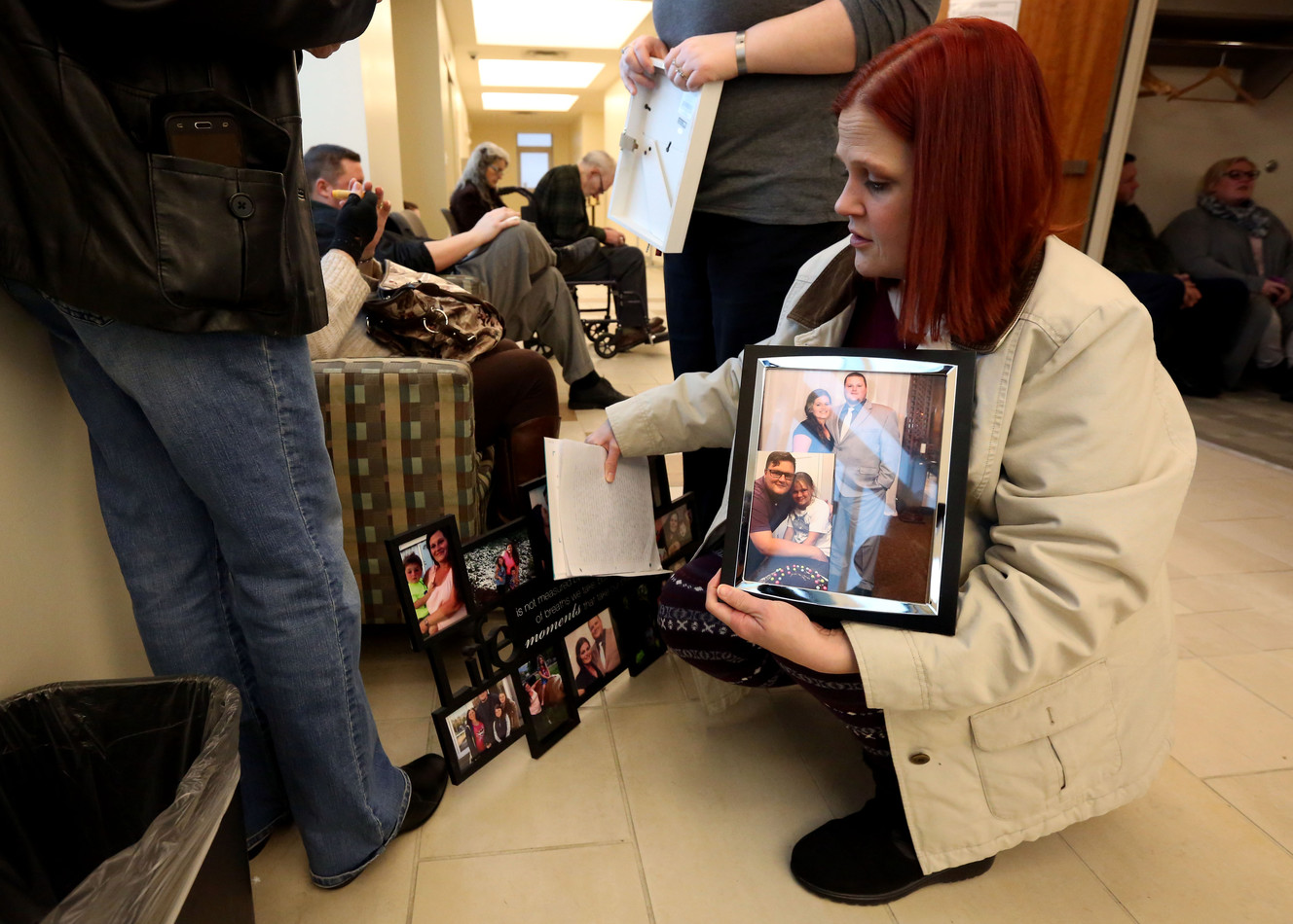 Buffee Best holds photos of her sister-in-law, Ashleigh Best, before the sentencing of Kenneth Lee Drew for manslaughter in 4th District Court in American Fork on Tuesday, Jan. 10, 2017. Best died in a car accident while fleeing Drew, who was attempting to repossess Best's car. (Photo: Kristin Murphy, Deseret News)