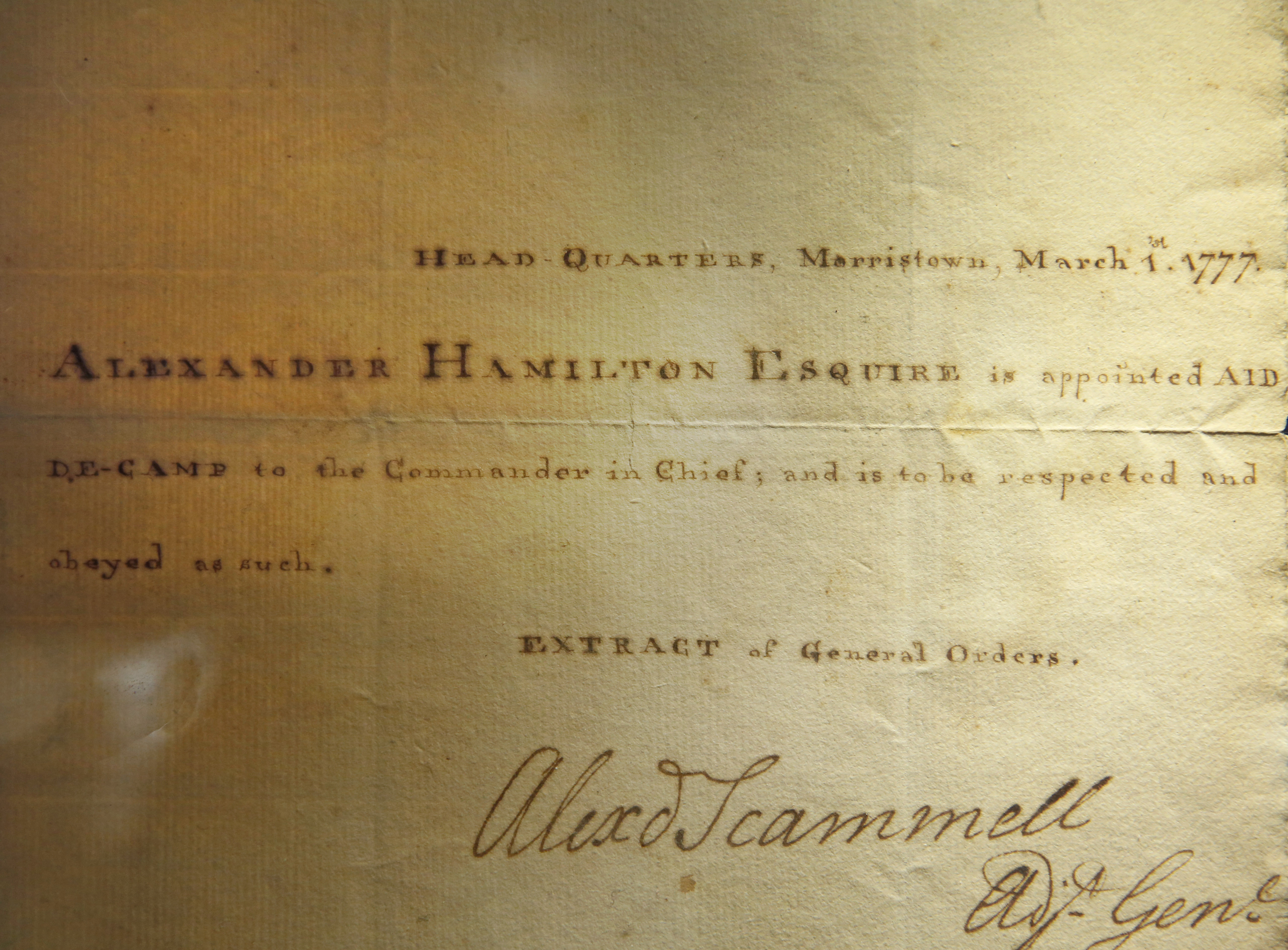 A detail of a document of Alexander Hamilton's appointment as aide-de-camp to General George Washington is displayed, Tuesday, Jan. 10, 2017, at Sotheby's in New York. This document, along with a trove of artifacts related to Alexander Hamilton, including love letters to his wife Eliza, will be offered up for auction at Sotheby's Jan. 18. The collection of documents and other items have an estimated worth starting at $1.4 million and topping $2 million. (AP Photo/Kathy Willens)