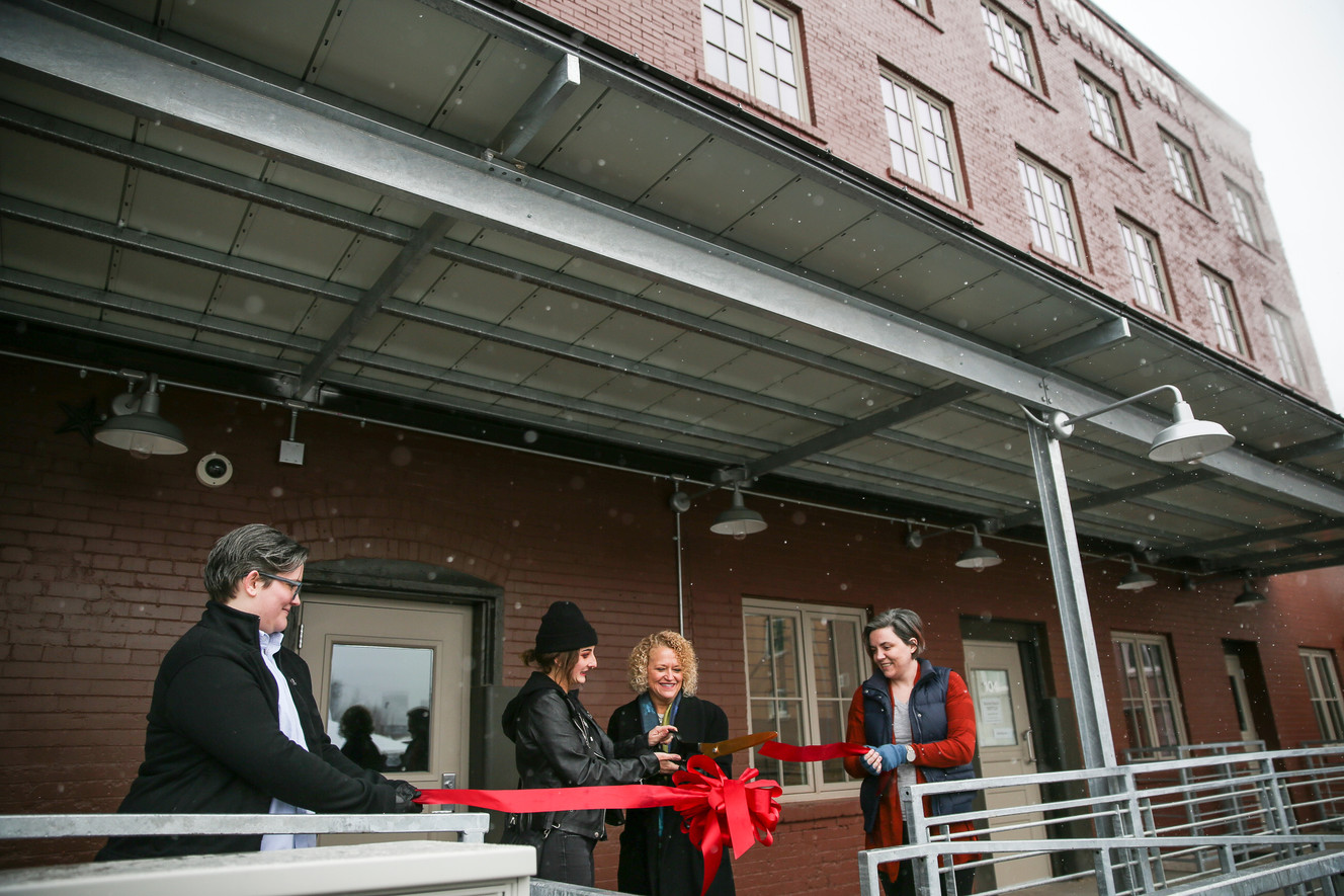 Salt Lake City Mayor Jackie Biskupski, second from right, is joined by tenants Abby Mars, Savannah Castranda and Carling Mars, left to right, at the opening of the Artspace Macaroni Flats in Salt Lake City on Thursday, Jan. 12, 2017. (Photo: Spenser Heaps, Deseret News)