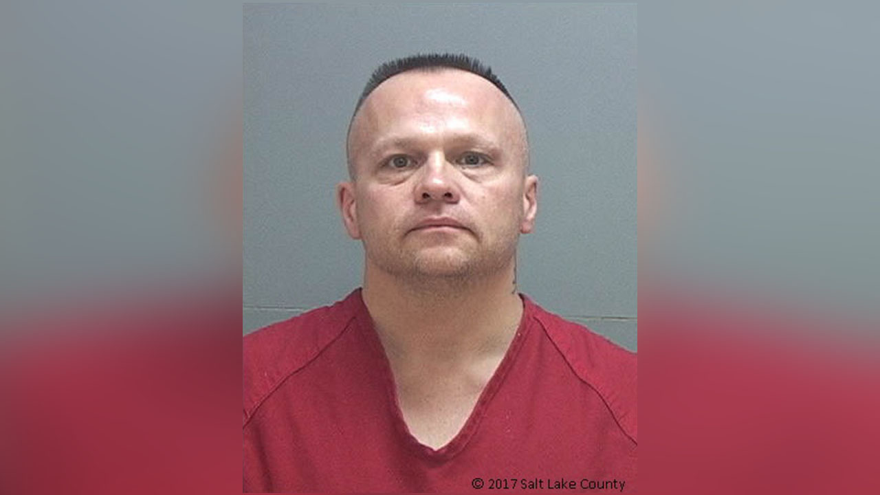 Couple charged with shooting at police from their motel room