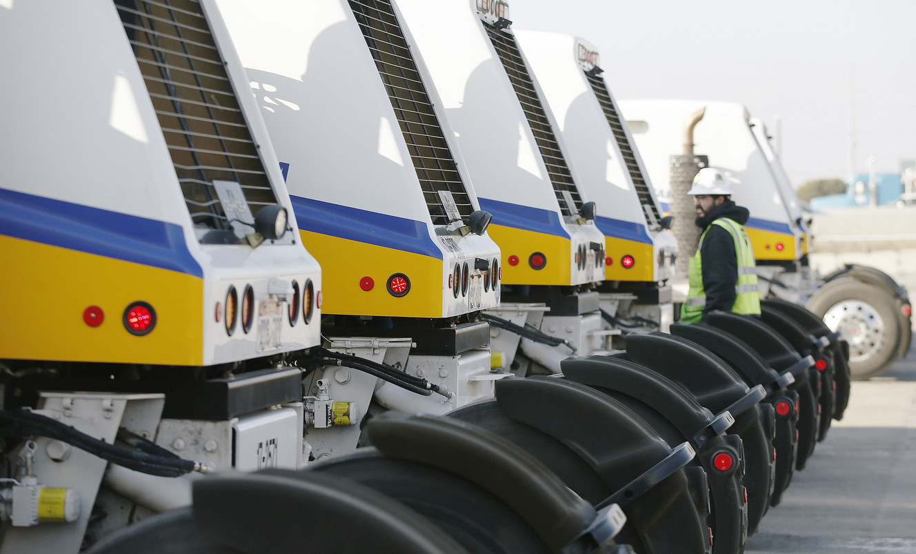 A driver walks past several concrete trucks at Geneva Rock in South Salt Lake on Wednesday, Jan. 18, 2017. Geneva Rock spent $8 million for a new compressed natural gas fueling station and a fleet of 25 compressed natural gas ready-mix concrete trucks. (Photo: Jeffrey D. Allred, Deseret News)