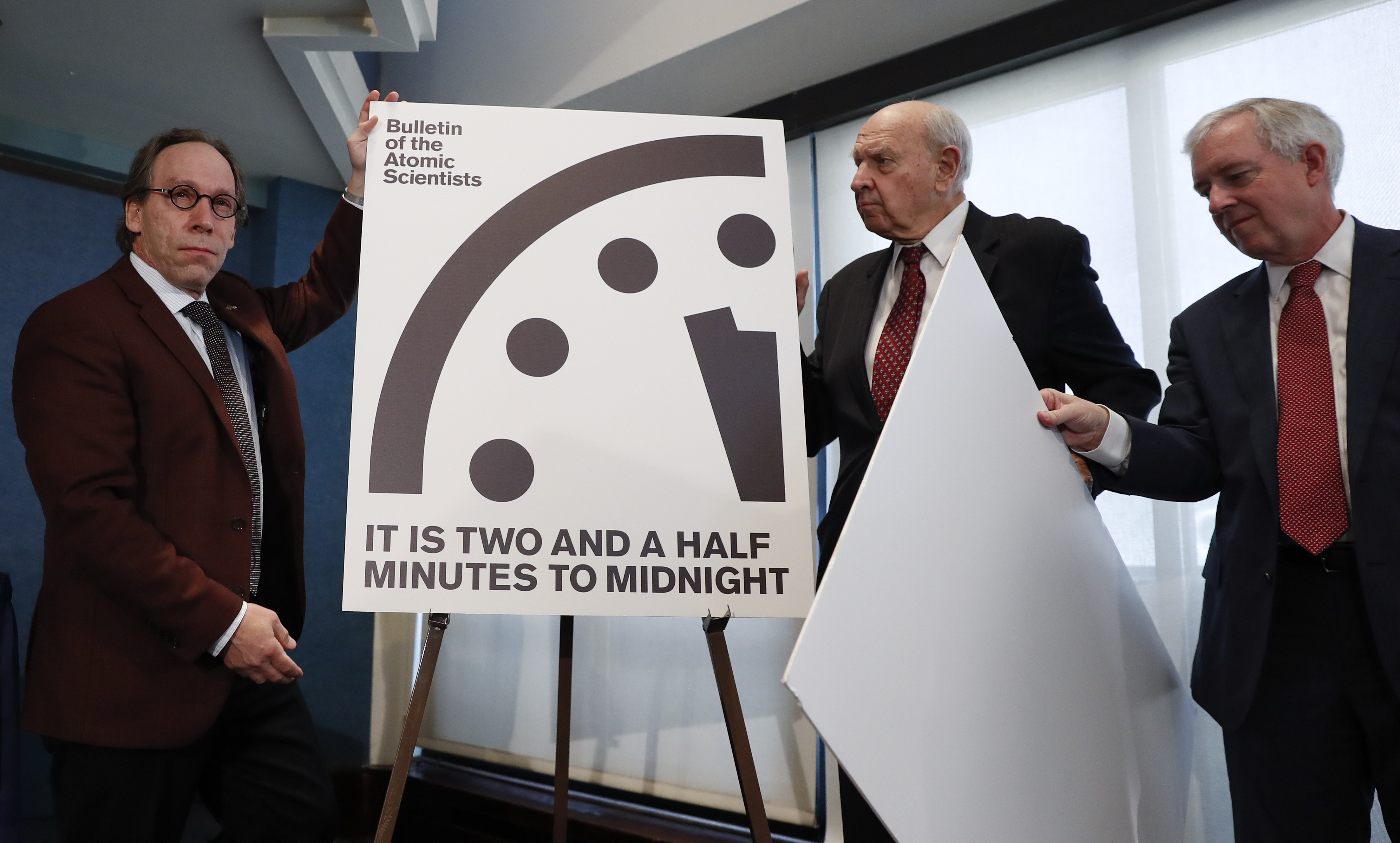 Lawrence Krauss, theoretical physicist, chair of the Bulletin of the Atomic Scientists Board of Sponsors, left, and Thomas Pickering, co-chair of the International Crisis Group, display the Doomsday Clock during a news conference the at the National Press Club in Washington, Thursday, Jan. 26, 2017, announcing that the Bulletin of the Atomic Scientist have moved the minute hand of the Doomsday Clock to two and a half minutes to midnight. (Carolyn Kaster, AP Photo)