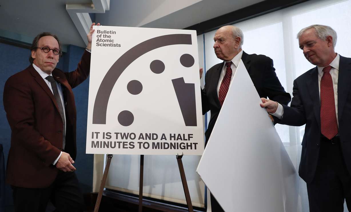 Lawrence Krauss, theoretical physicist, chair of the Bulletin of the Atomic Scientists Board of Sponsors, left, and Thomas Pickering, co-chair of the International Crisis Group, display the Doomsday Clock during a news conference the at the National Press Club in Washington, Thursday, Jan. 26, 2017, announcing that the Bulletin of the Atomic Scientist have moved the minute hand of the Doomsday Clock to two and a half minutes to midnight. (Carolyn Kaster, AP Photo)