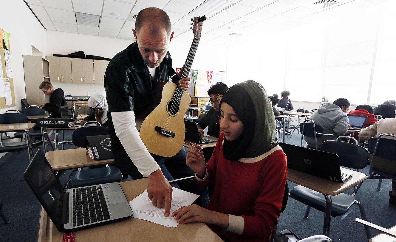 Teacher Thomas Clayton helps student Maryam Jasim with eighth-grade math at Granite Park Junior High in South Salt Lake on Friday, Jan. 27, 2017. (Photo: Ravell Call, Deseret News)