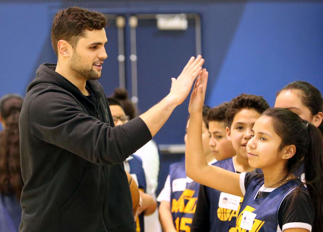 Utah Jazz player Raul Neto high fives his NBA Math Hoops teammates at the Zions Bank Basketball Center in Salt Lake City on Monday, Jan. 30, 2017. (Photo: Kristin Murphy, Deseret News)