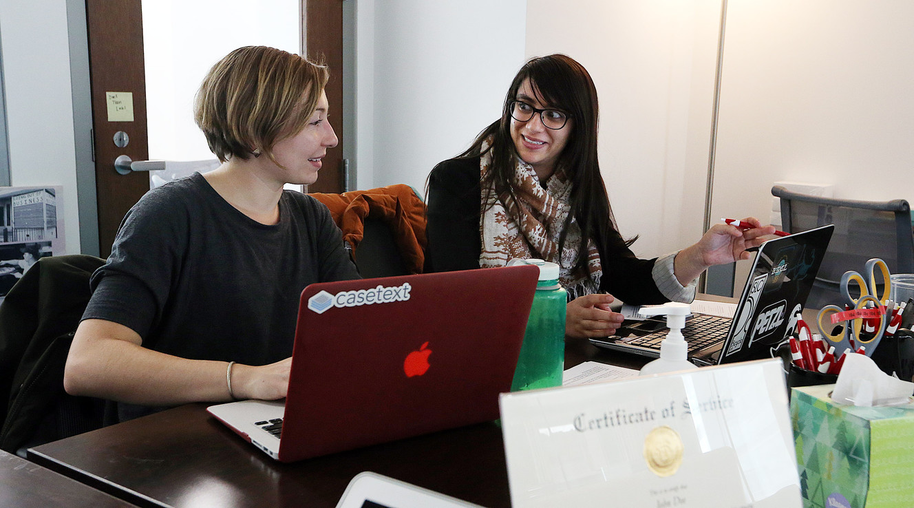 Mel Moeinvaziri, right, law student and fellow with the Pro Bono Initiative at the University of Utah, works with another Pro Bono Initiative fellow, Liz Thomas, in Salt Lake City on Monday, Jan. 30, 2017. (Photo: Ravell Call, Deseret News)