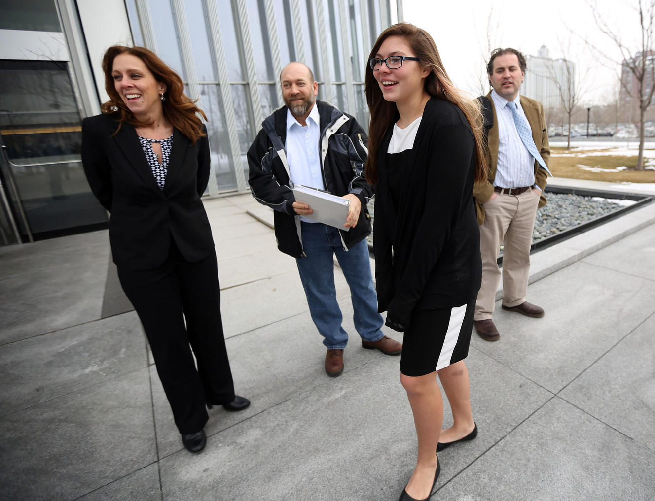 Kelly Janis, Lee Garcia, Kathleen Janis and Monte Sleight gather outside the federal courthouse in Salt Lake City on Wednesday, Feb. 1, 2017. Kathleen, a ninth-grade student at Central Davis Junior High, is suing the Davis School District because she isn't allowed to participate in her school's wrestling program. (Photo: Kristin Murphy, Deseret News)